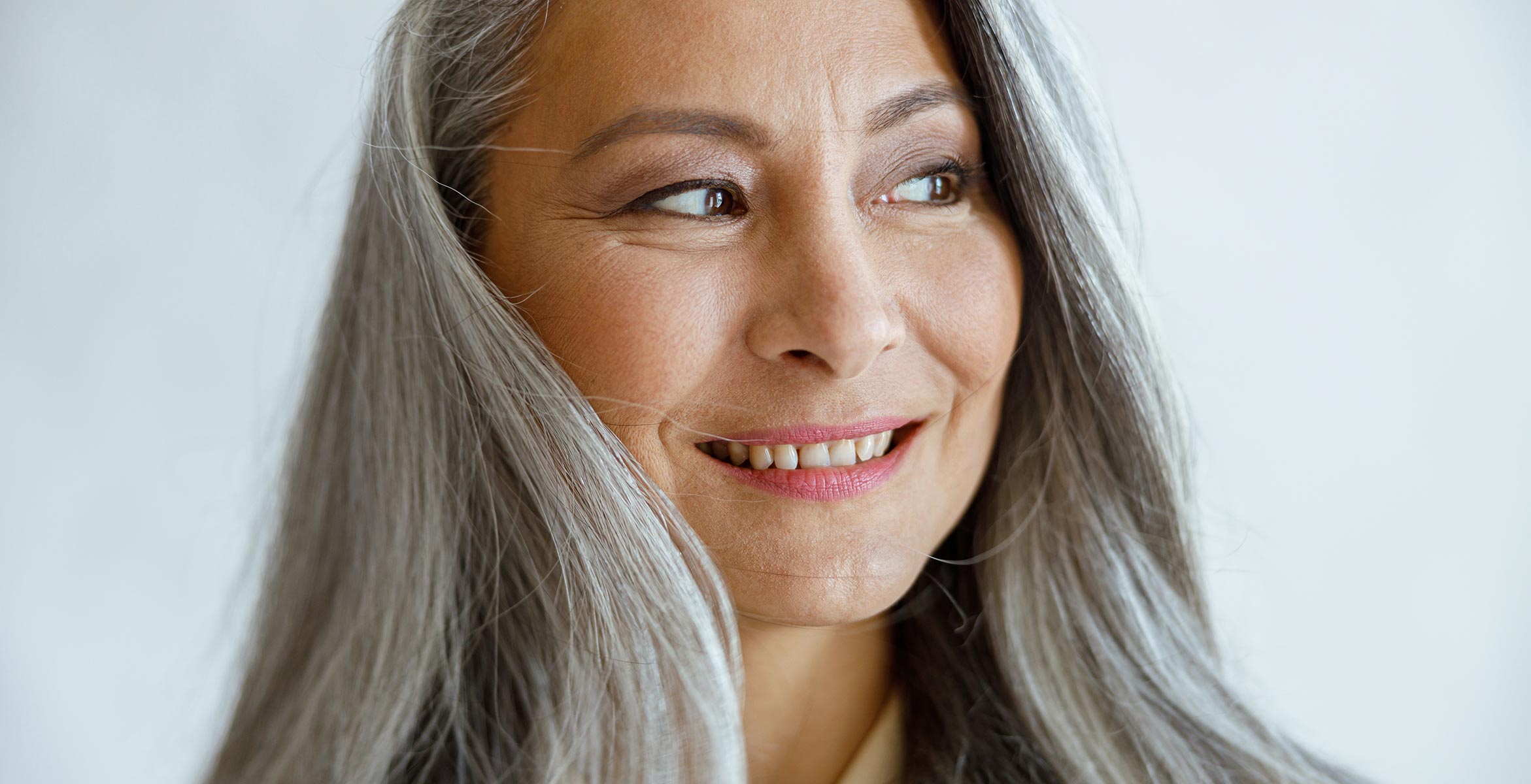 mature woman with healthy grey hair