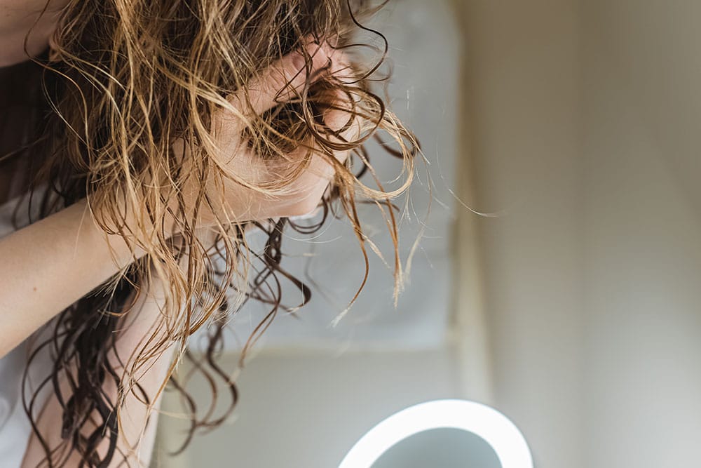 air dry your hair to avoid frizz
