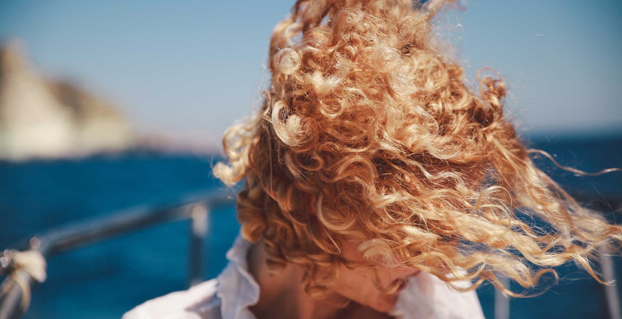 how to tame summer frizz